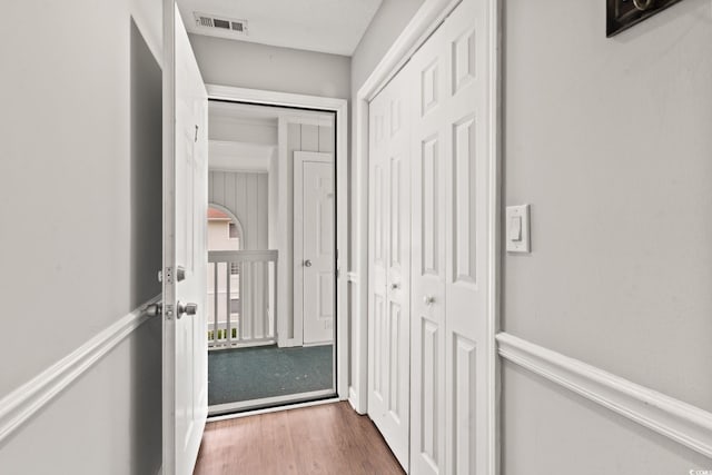 corridor featuring dark hardwood / wood-style floors