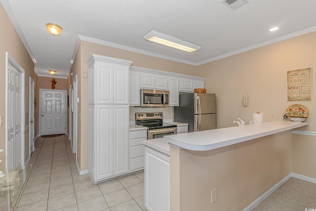 kitchen featuring white cabinetry, kitchen peninsula, appliances with stainless steel finishes, light tile patterned floors, and ornamental molding