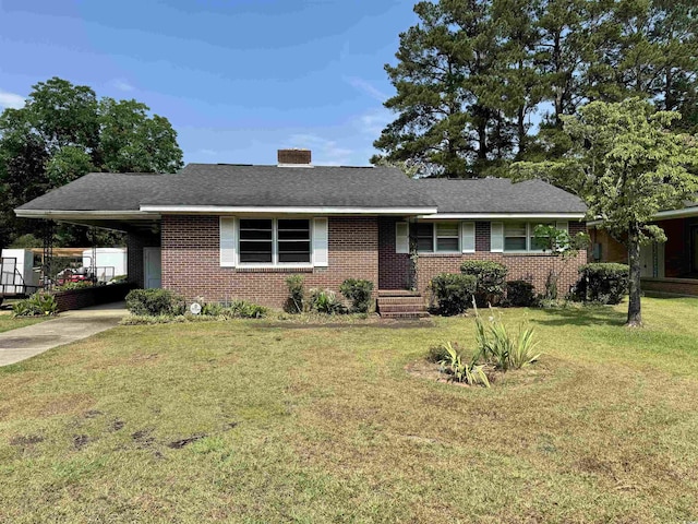 single story home with a carport and a front lawn