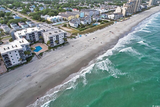 drone / aerial view featuring a view of the beach and a water view