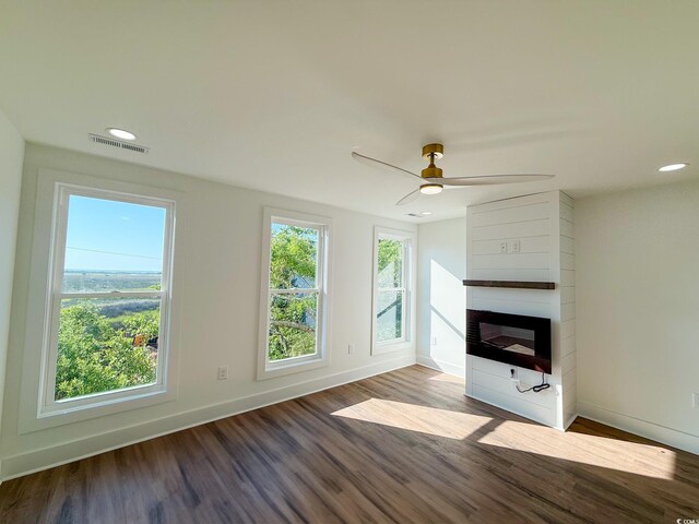 189 Brown Pelican Loop, Pawleys Island, SC 29585 - unfurnished living room with wood finished floors, a fireplace, baseboards, recessed lighting, and ceiling fan