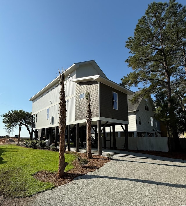 189 Brown Pelican Loop, Pawleys Island, SC 29585 - view of property featuring a carport and driveway