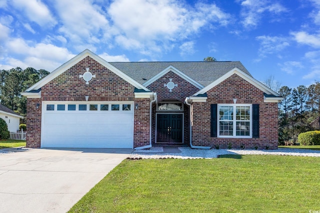 view of front of home featuring a front yard and a garage