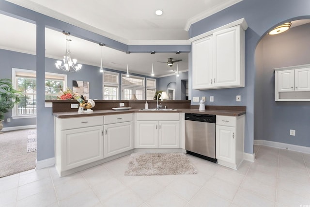 kitchen featuring white cabinetry, dishwasher, ornamental molding, ceiling fan with notable chandelier, and sink