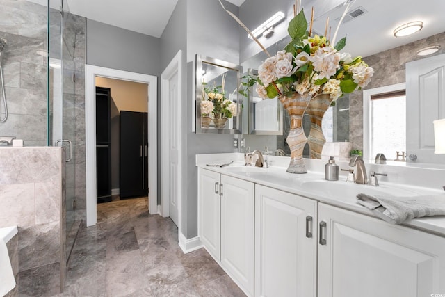 bathroom with vanity and walk in shower