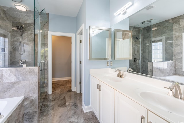 bathroom with vanity and shower with separate bathtub