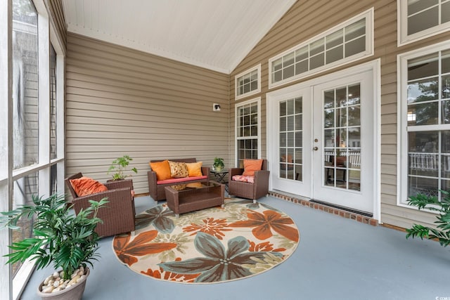 sunroom with vaulted ceiling and wood ceiling