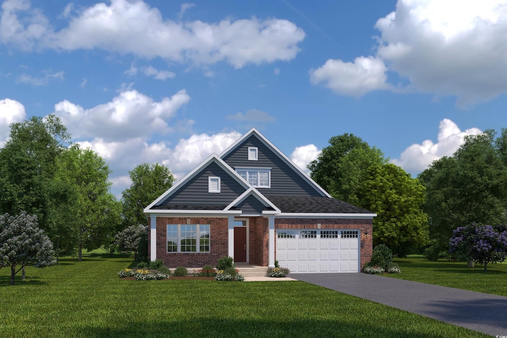 view of front of property with a front yard and a garage