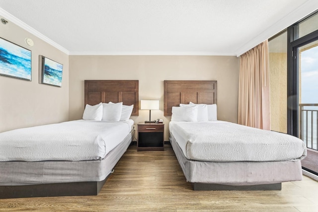 bedroom featuring hardwood / wood-style flooring and ornamental molding