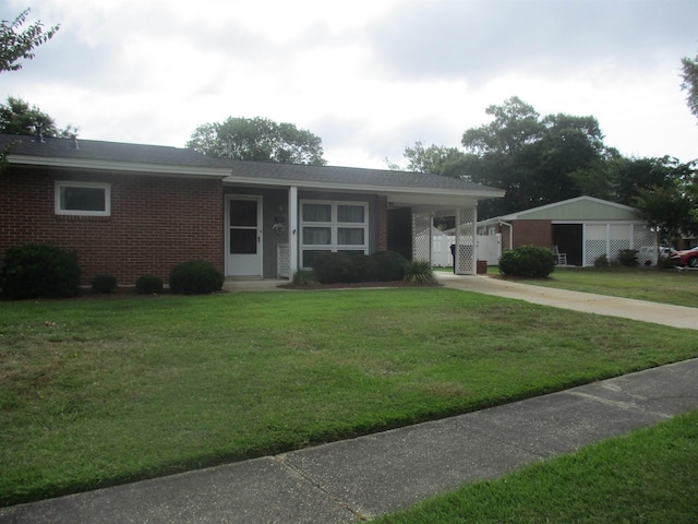 ranch-style home with a carport and a front lawn