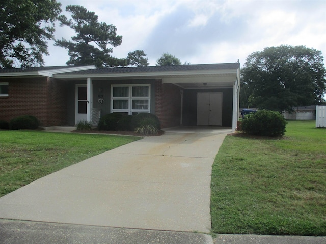 view of front facade with a carport and a front lawn