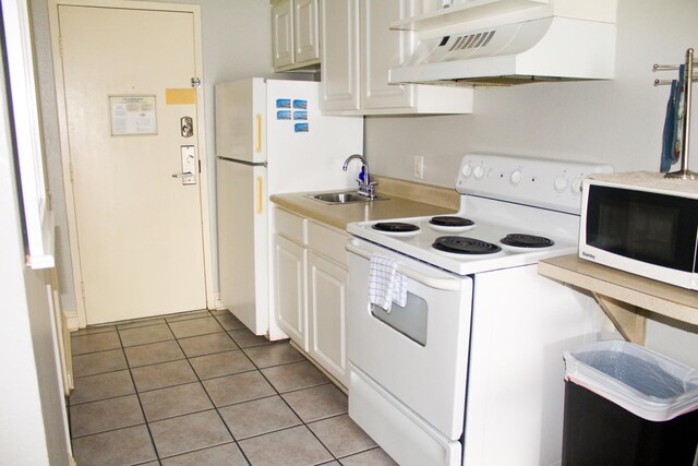 1207 S Ocean Blvd Unit 50606, Myrtle Beach, SC 29577 - kitchen featuring white appliances, sink, light tile patterned floors, white cabinetry, and custom range hood