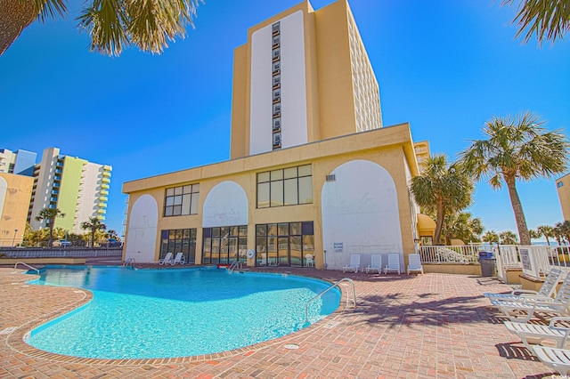 view of swimming pool featuring a patio area