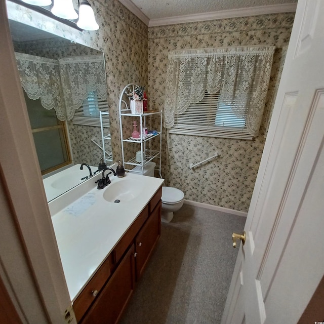 bathroom with vanity, toilet, and ornamental molding