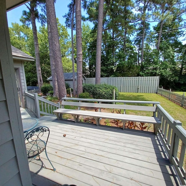 wooden deck with a yard