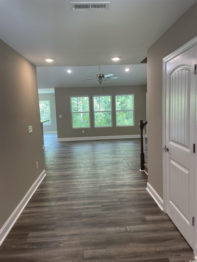 hall with dark hardwood / wood-style floors