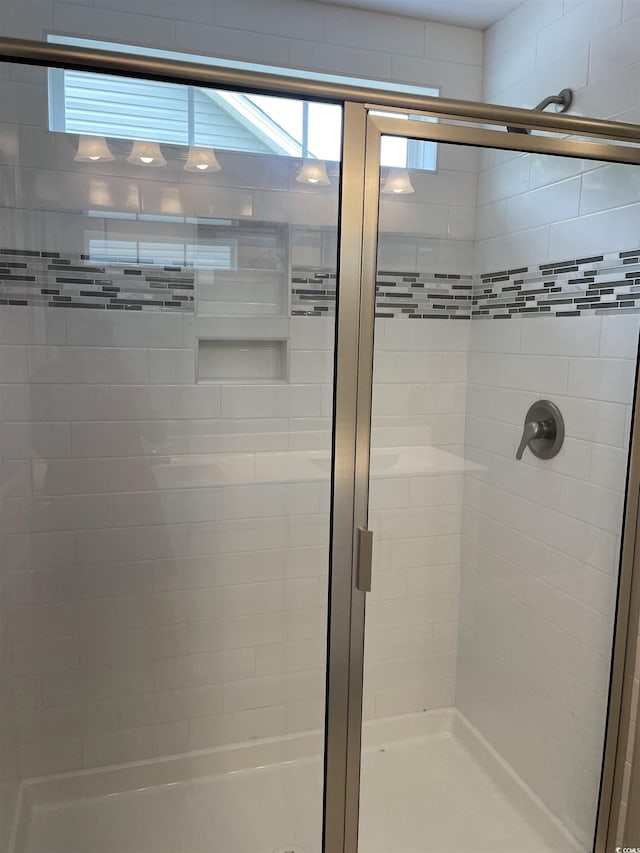 bathroom featuring an enclosed shower