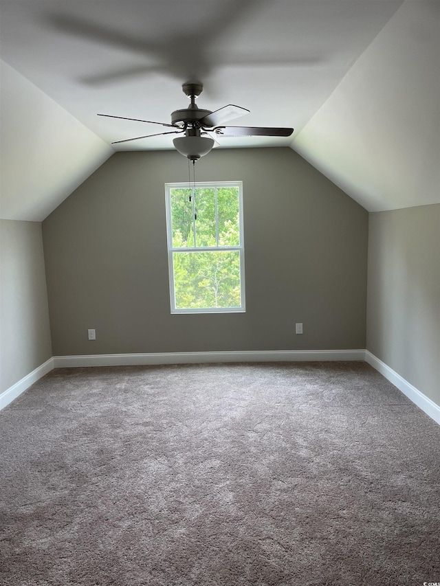 bonus room with ceiling fan, lofted ceiling, and carpet floors