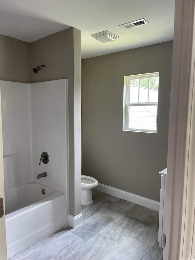 full bathroom featuring toilet, vanity, and bathing tub / shower combination