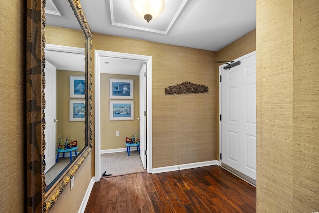 interior space with dark hardwood / wood-style floors and a barn door