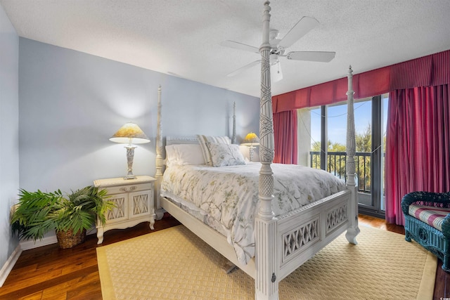 bedroom featuring ceiling fan, a textured ceiling, hardwood / wood-style flooring, and access to exterior