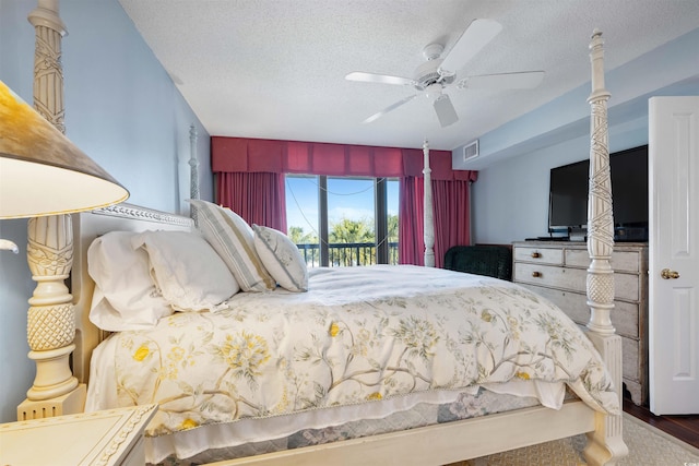 bedroom featuring ceiling fan, a textured ceiling, and access to outside