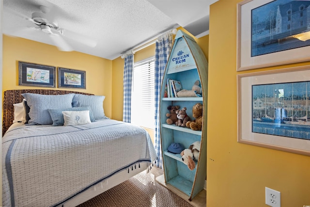 bedroom featuring carpet, ceiling fan, and a textured ceiling