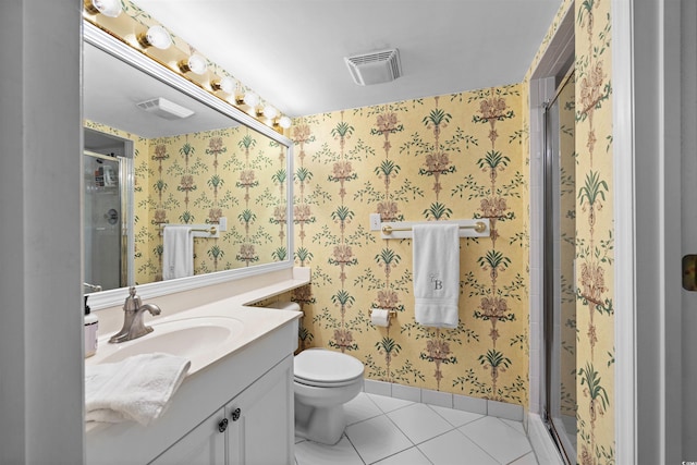 bathroom featuring tile flooring, an enclosed shower, toilet, and large vanity