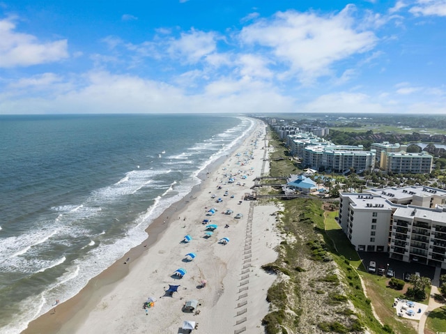 bird's eye view featuring a beach view and a water view