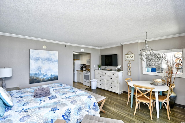 bedroom featuring a chandelier, white refrigerator, a textured ceiling, and ornamental molding