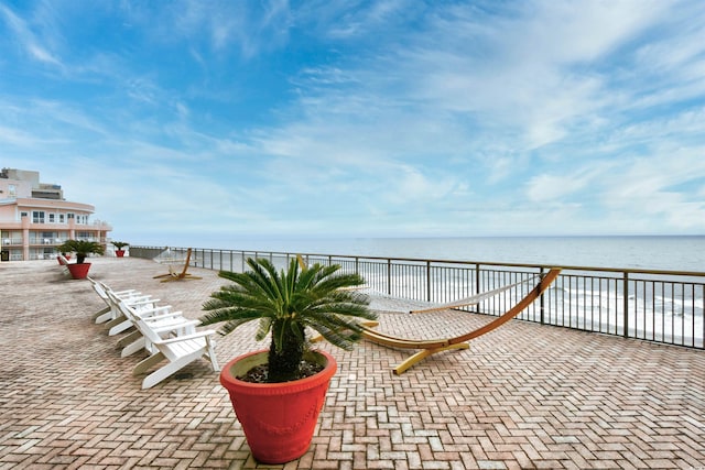 view of patio / terrace with a water view