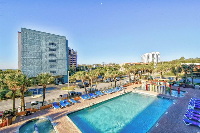 view of swimming pool with a patio area