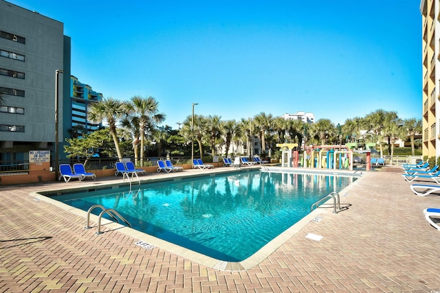 view of swimming pool featuring a patio area