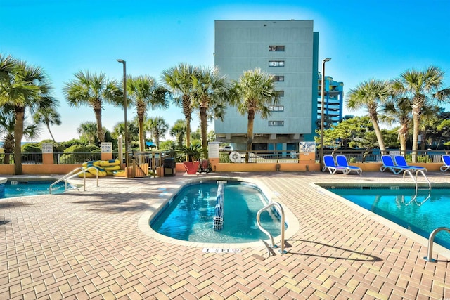 view of swimming pool with a patio