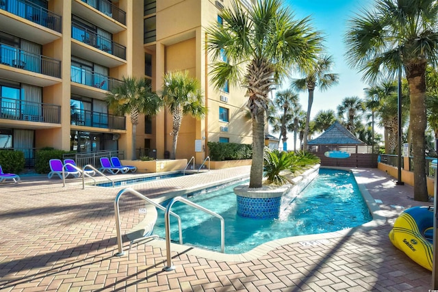 view of pool featuring a patio