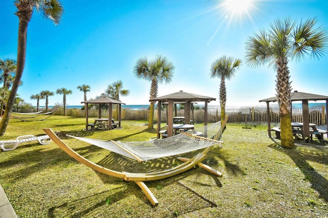 view of yard featuring a water view and a gazebo