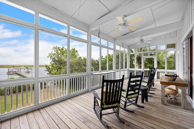 sunroom featuring vaulted ceiling with beams and ceiling fan