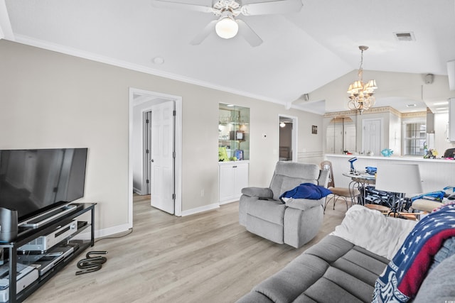 living room featuring ceiling fan with notable chandelier, light wood-type flooring, ornamental molding, and vaulted ceiling