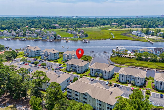 birds eye view of property featuring a water view