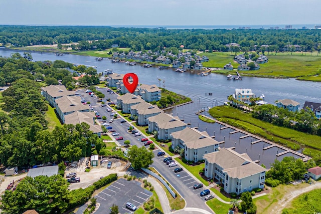 birds eye view of property with a water view