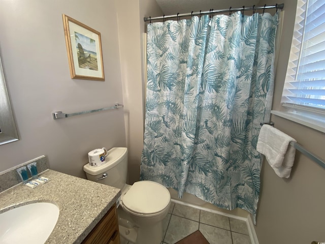 bathroom with tile patterned flooring, vanity, toilet, and a shower with shower curtain