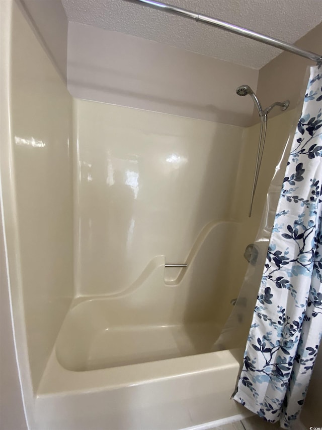 bathroom featuring a textured ceiling