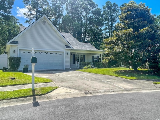 view of front of house with a garage and a front lawn