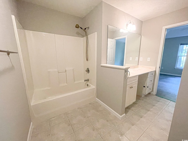 bathroom with shower / bathing tub combination, vanity, tile patterned flooring, and a textured ceiling