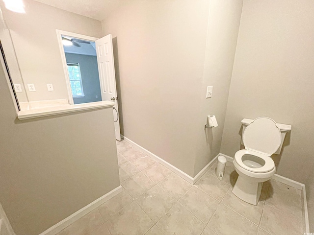 bathroom featuring tile patterned floors and toilet