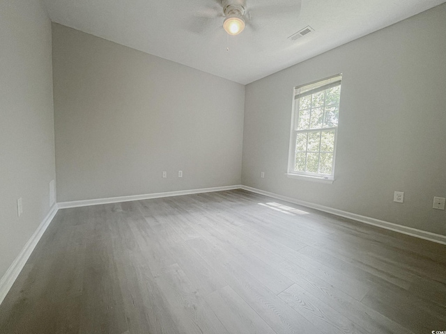 empty room with wood-type flooring and ceiling fan