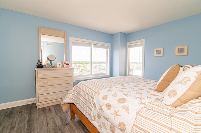 5800 N Ocean Blvd Unit 705, North Myrtle Beach, SC 29582 - bedroom featuring dark wood-style floors and baseboards