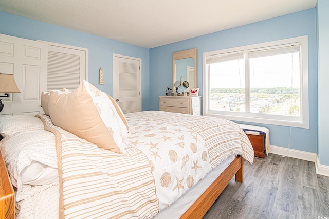 5800 N Ocean Blvd Unit 705, North Myrtle Beach, SC 29582 - bedroom featuring wood finished floors and baseboards