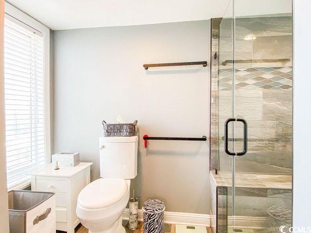 5800 N Ocean Blvd Unit 705, North Myrtle Beach, SC 29582 - bathroom with toilet and a shower stall
