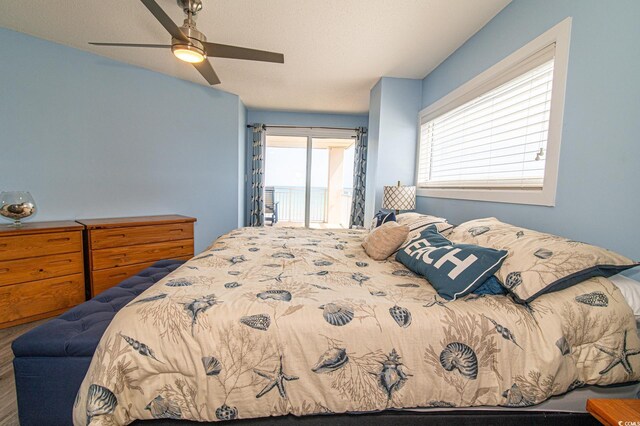 5800 N Ocean Blvd Unit 705, North Myrtle Beach, SC 29582 - bedroom with access to exterior, ceiling fan, and wood finished floors